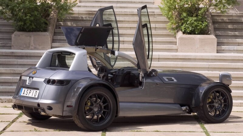 Silver Aspid sports car with open doors