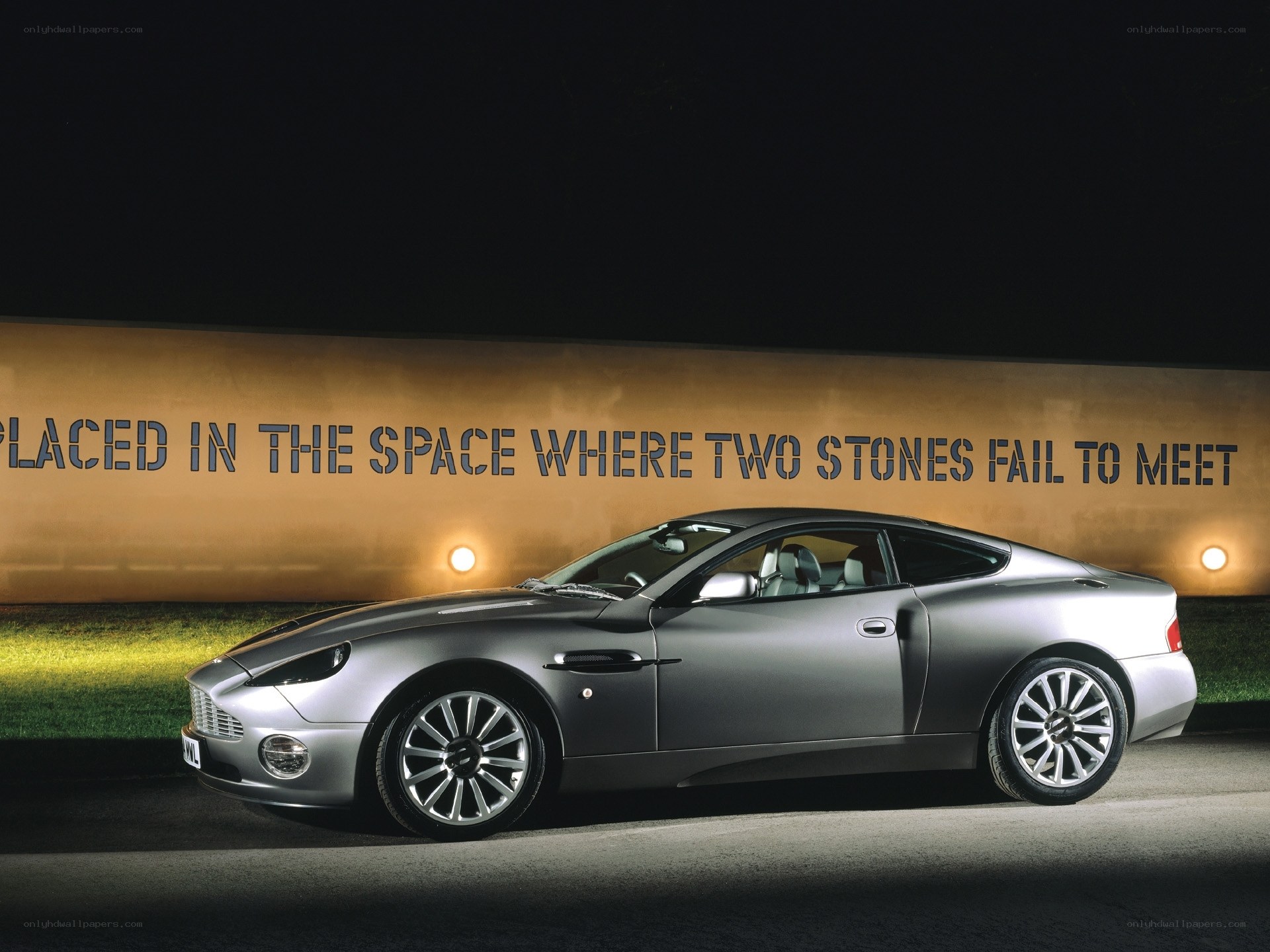silver aston martin at night