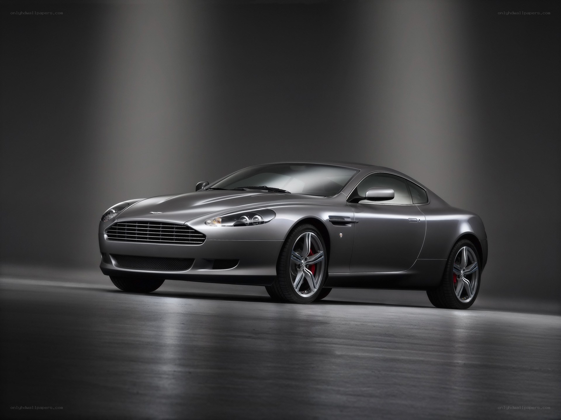 silver aston martin coupe