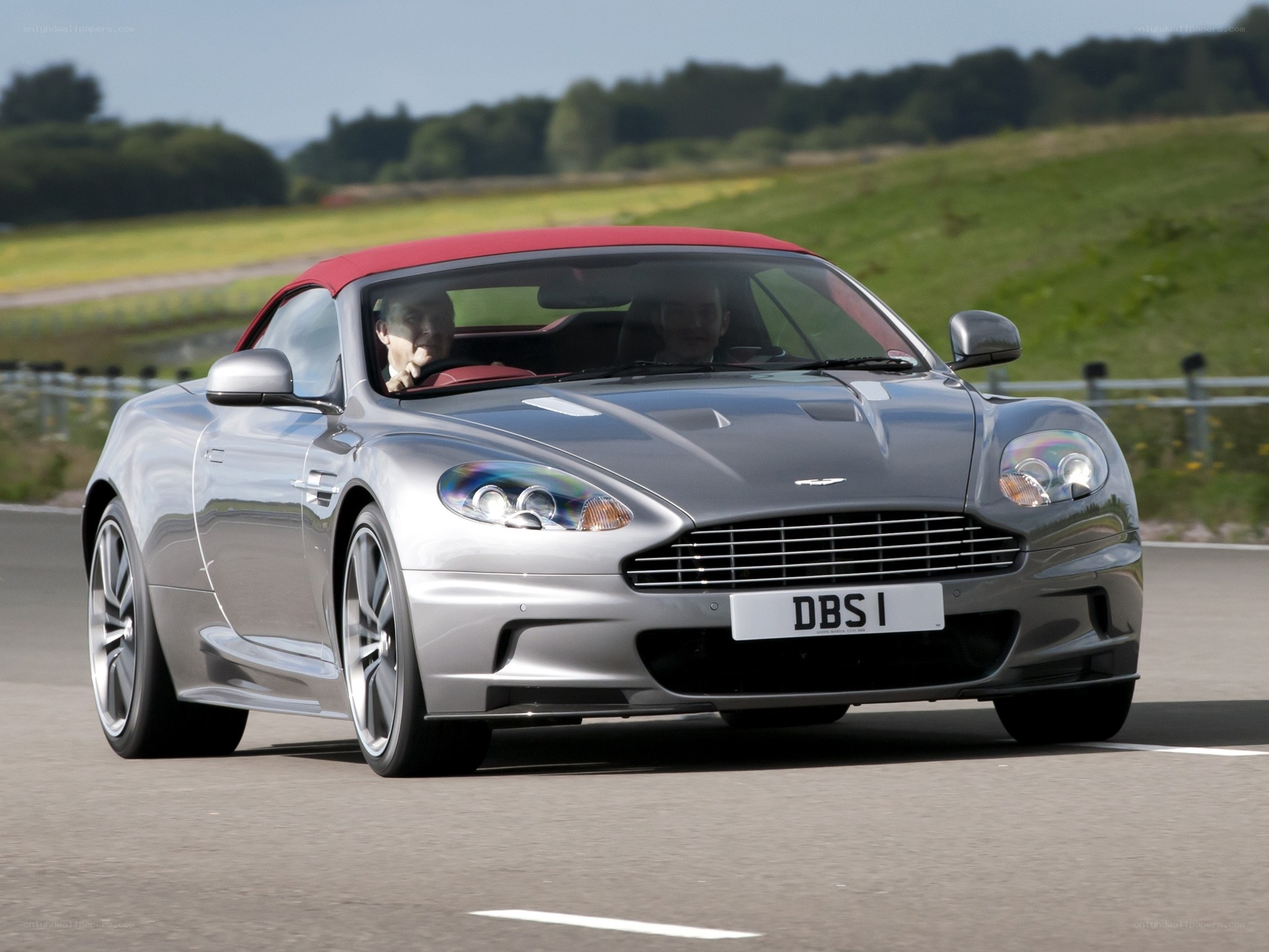 silver aston martin db9 driving