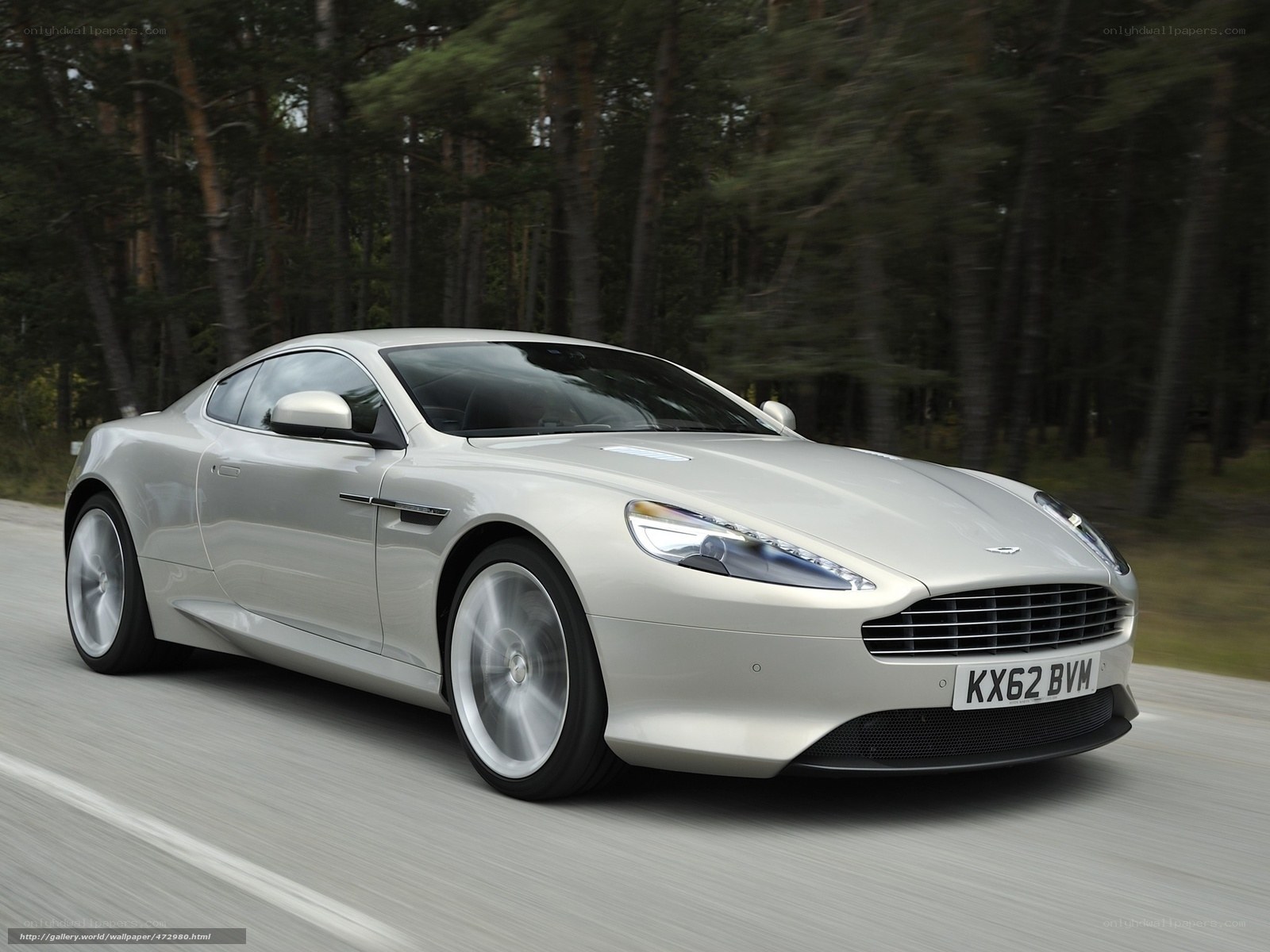 silver aston martin driving