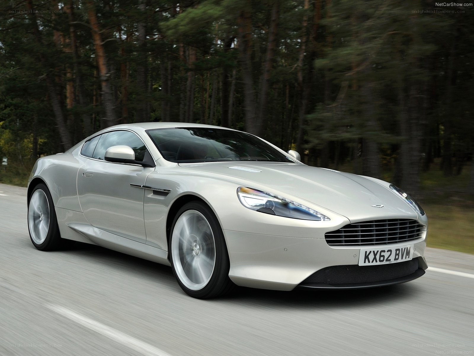 silver aston martin driving