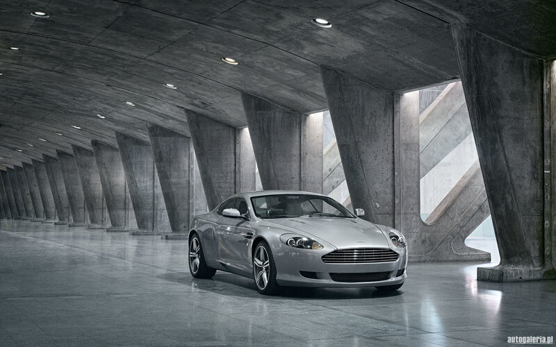 Silver Aston Martin in concrete tunnel