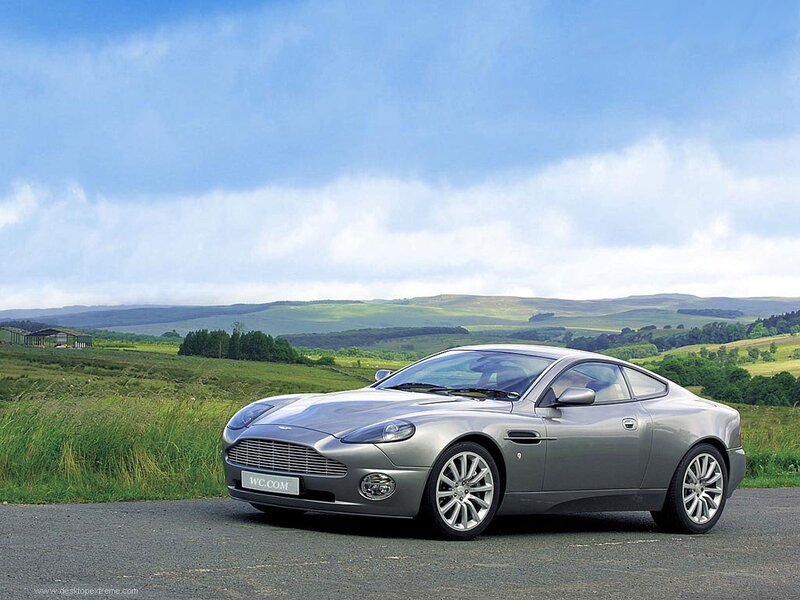 silver aston martin in countryside