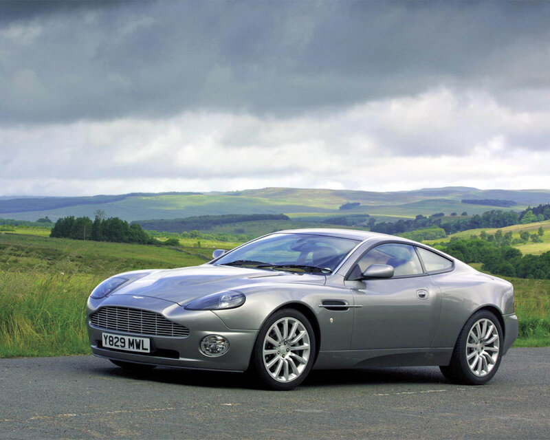 Silver Aston Martin in countryside