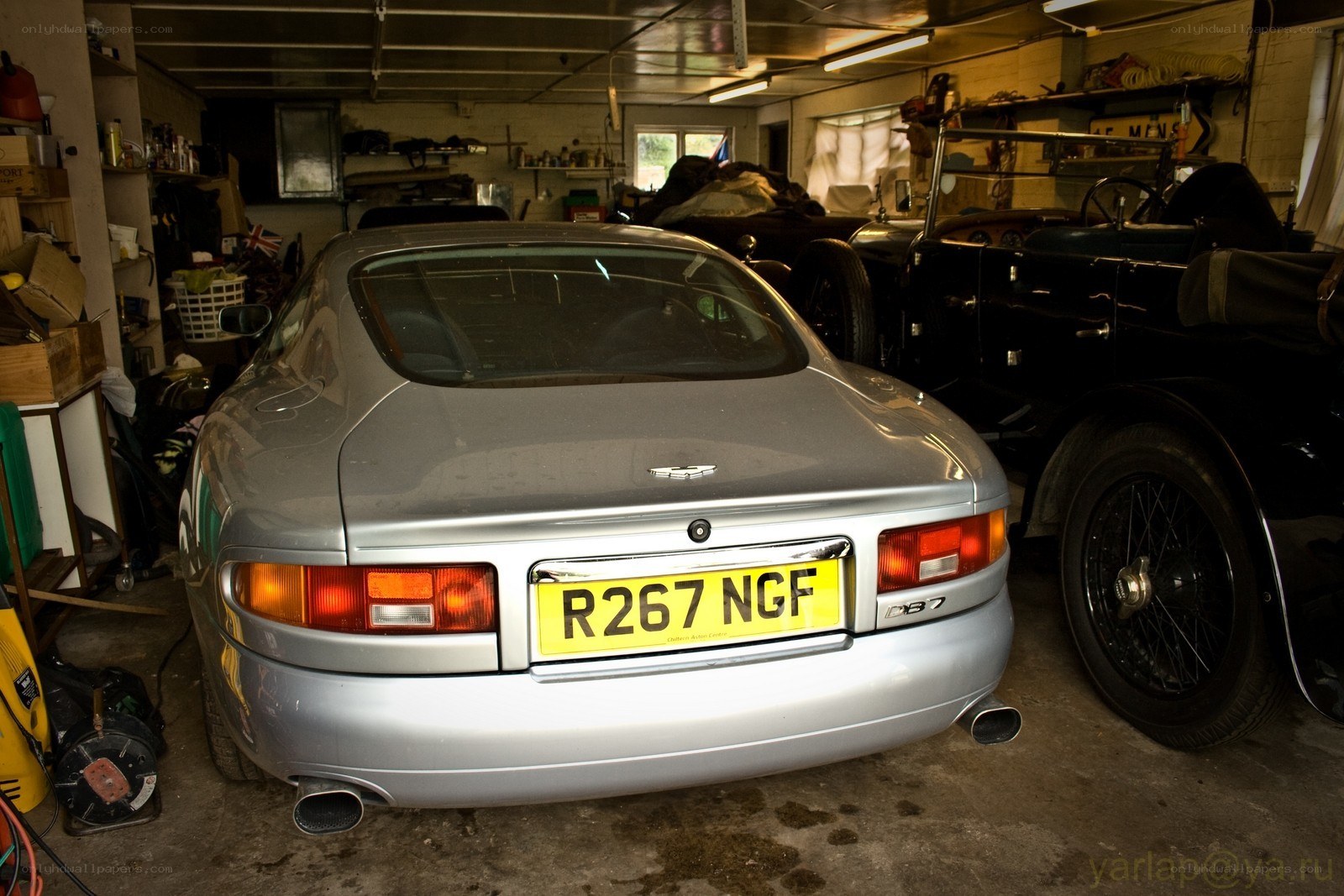Silver Aston Martin in garage