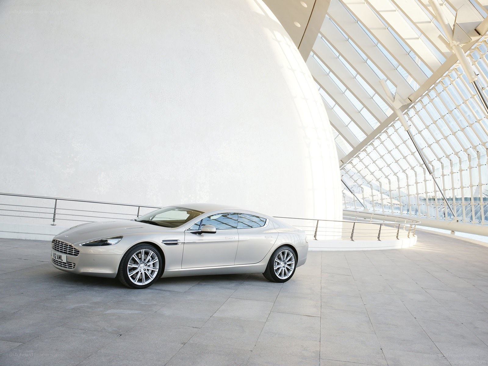 Silver Aston Martin in modern architecture