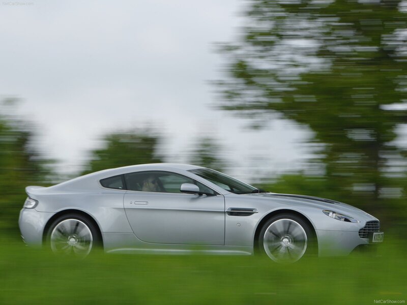 silver aston martin in motion