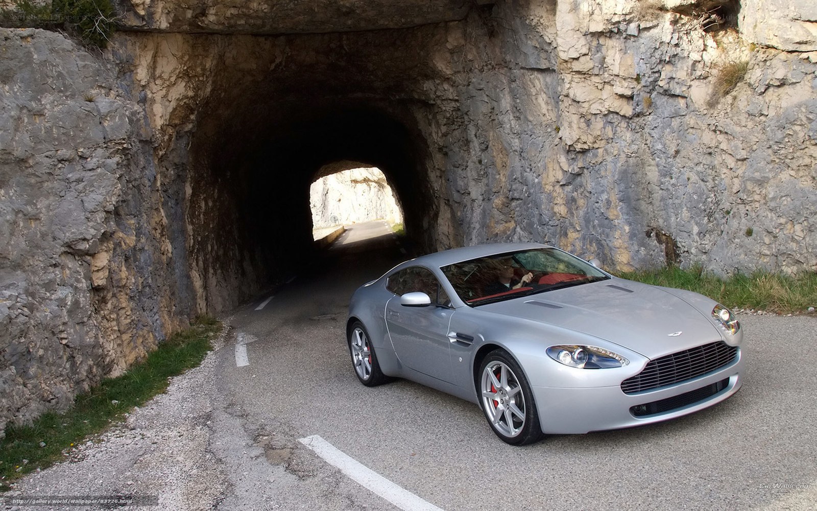 Silver Aston Martin in tunnel
