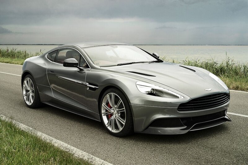 Silver Aston Martin on coastal road