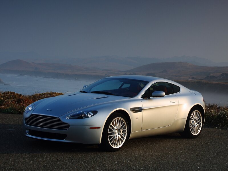 Silver Aston Martin on coastal road