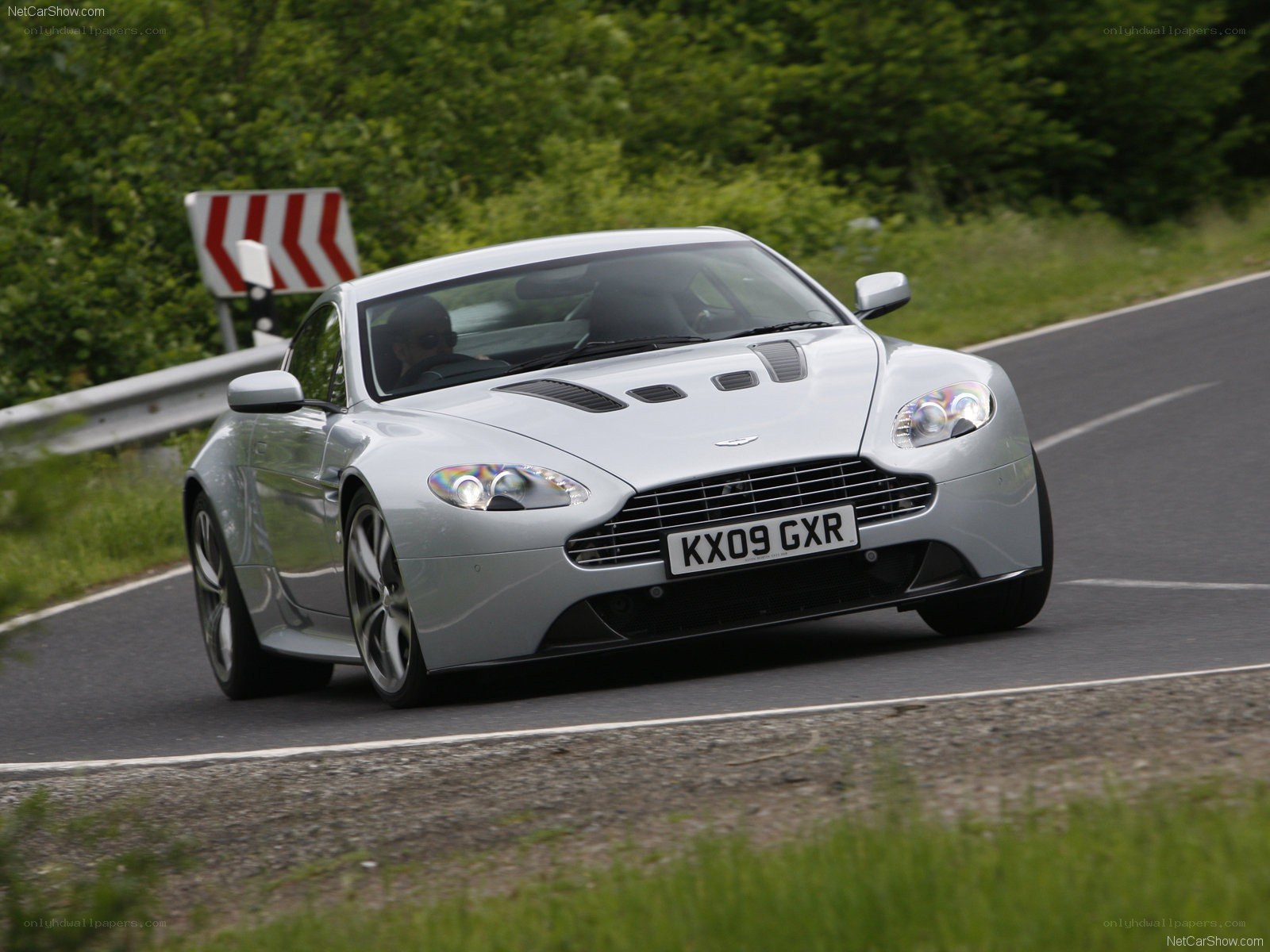 silver aston martin on road