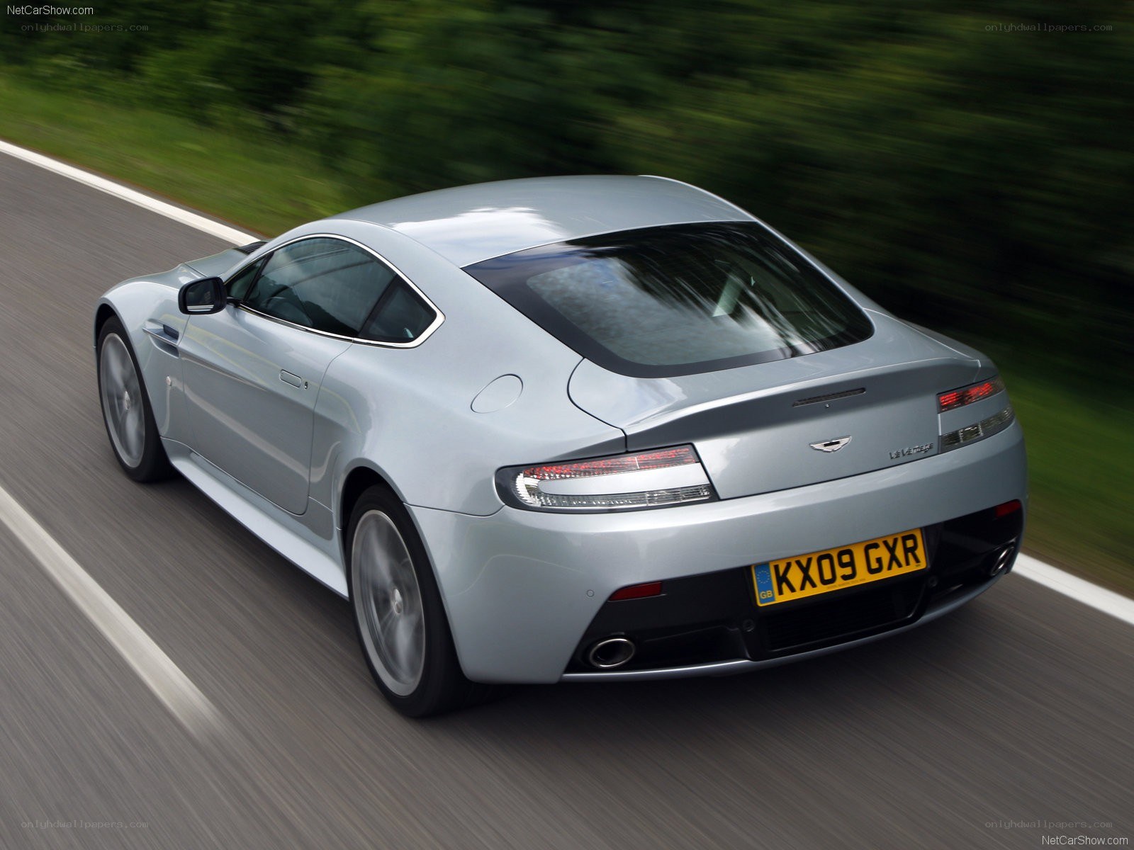 silver aston martin on road