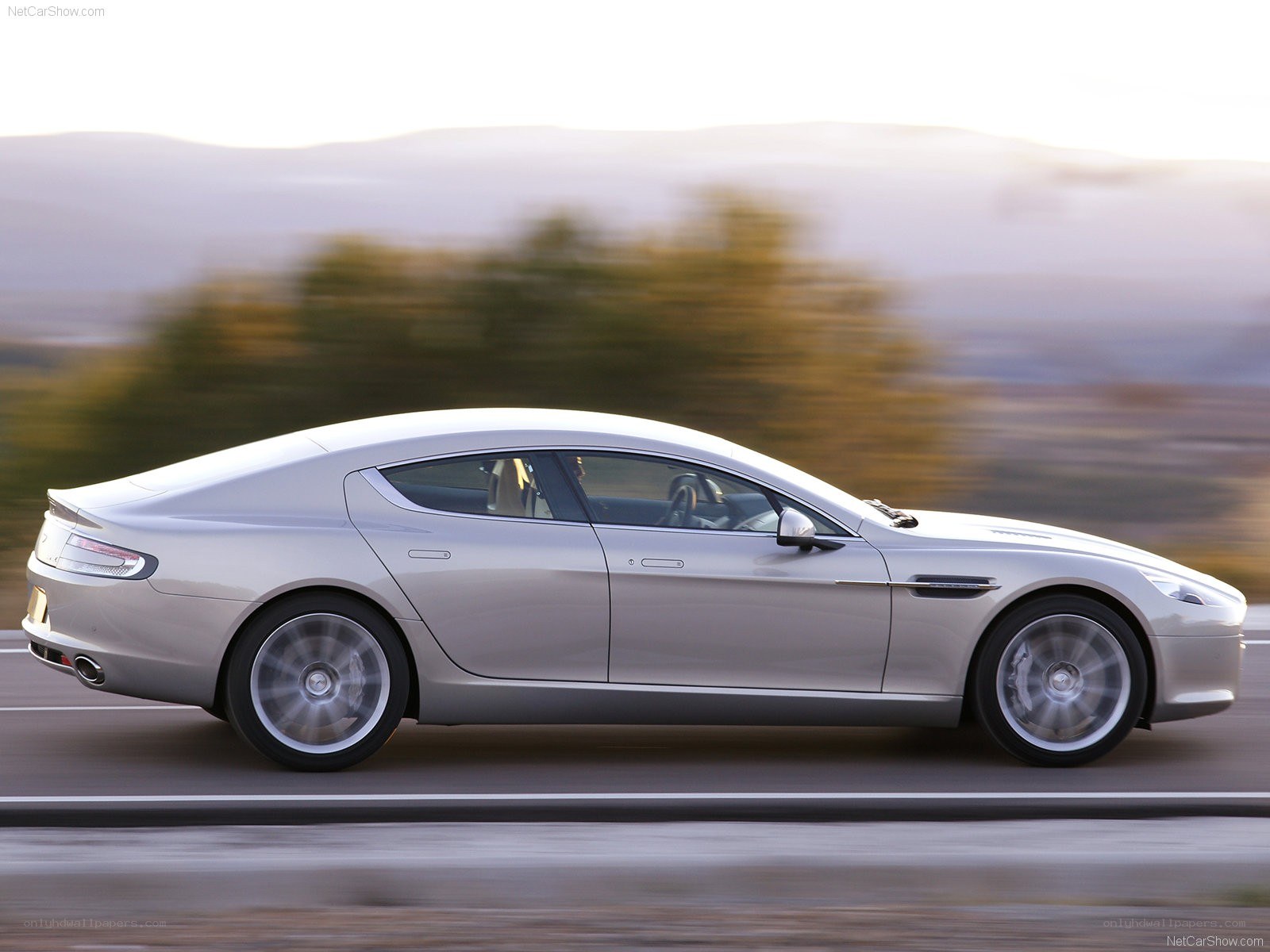 silver aston martin on road