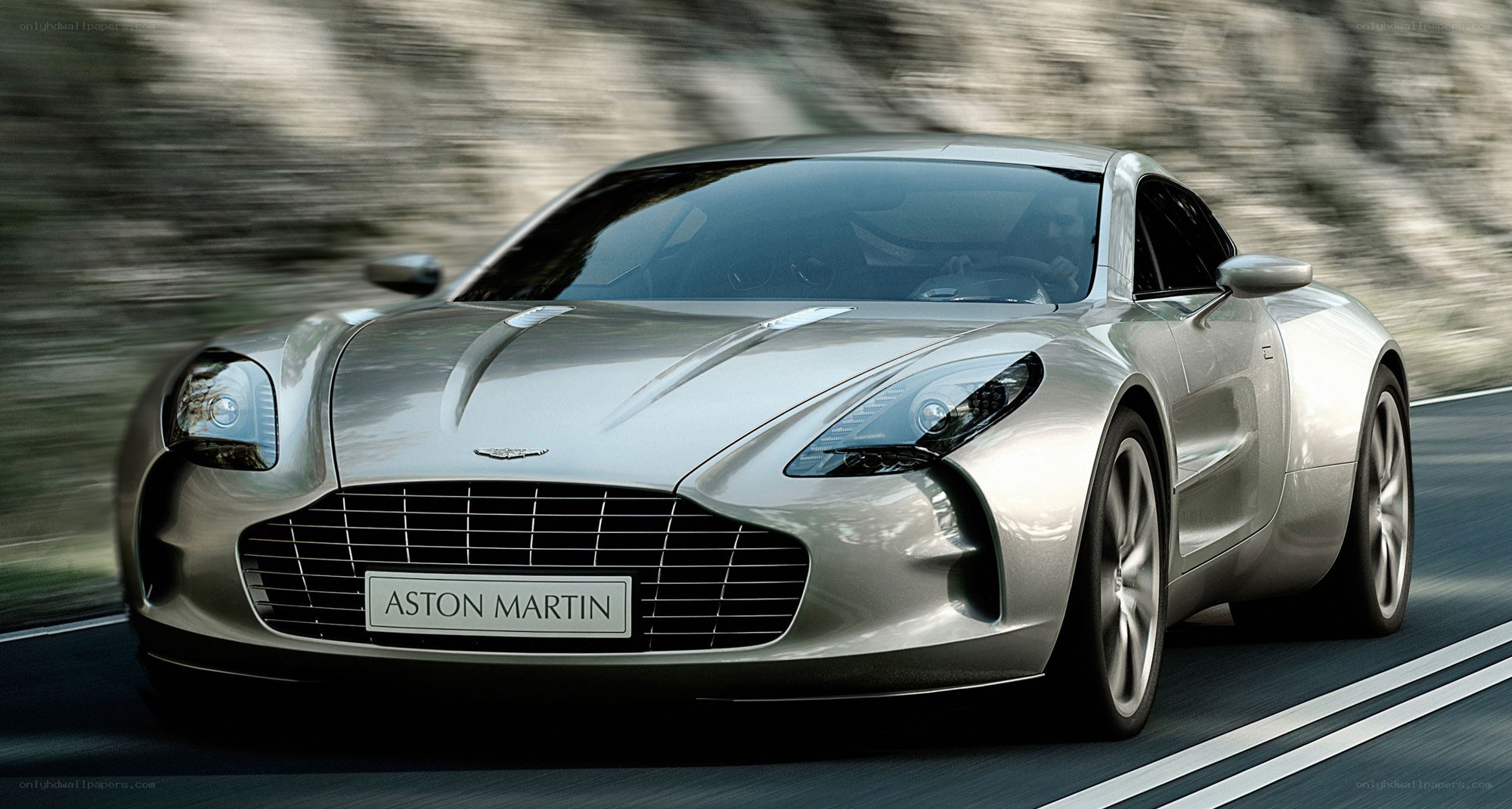 silver aston martin on road