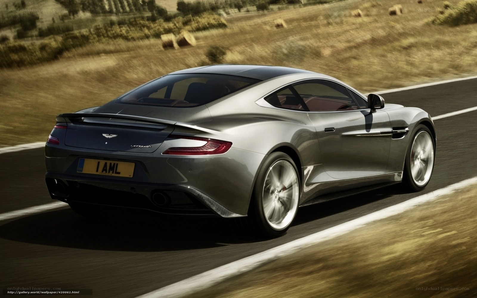 silver aston martin on road