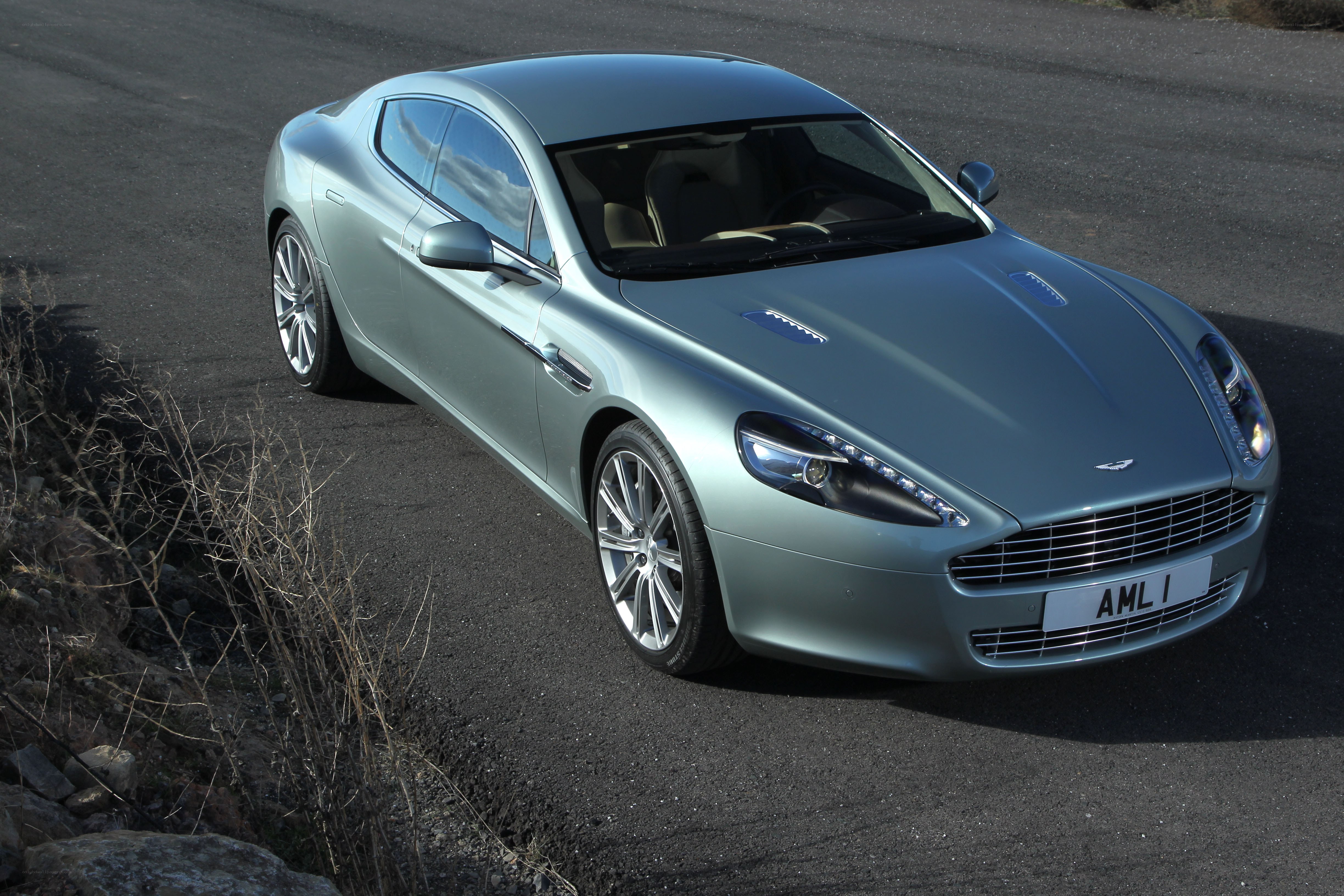 silver aston martin on road