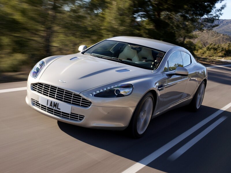 Silver Aston Martin on Road — Dynamic