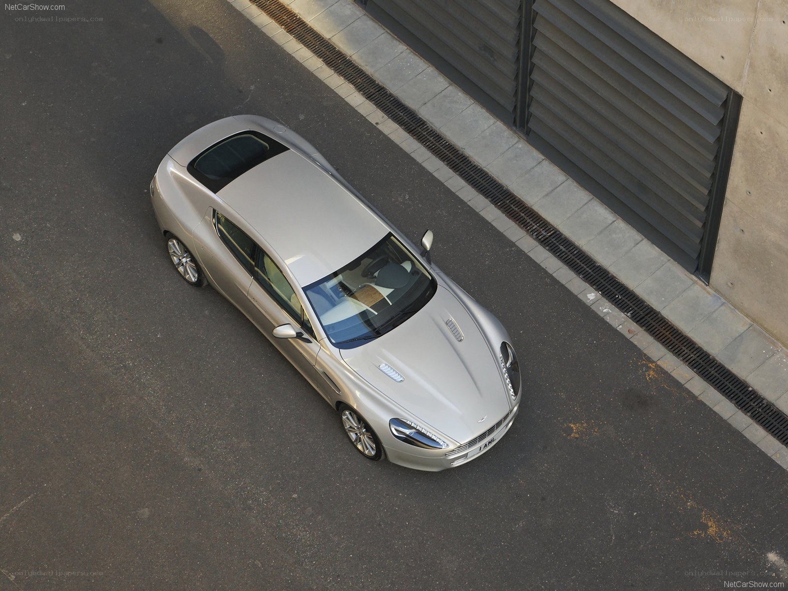 silver aston martin on street