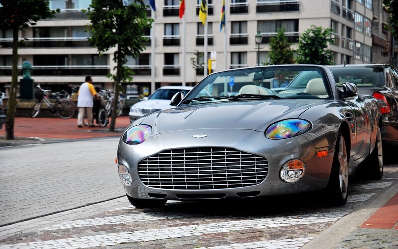 Silver Aston Martin parked on street