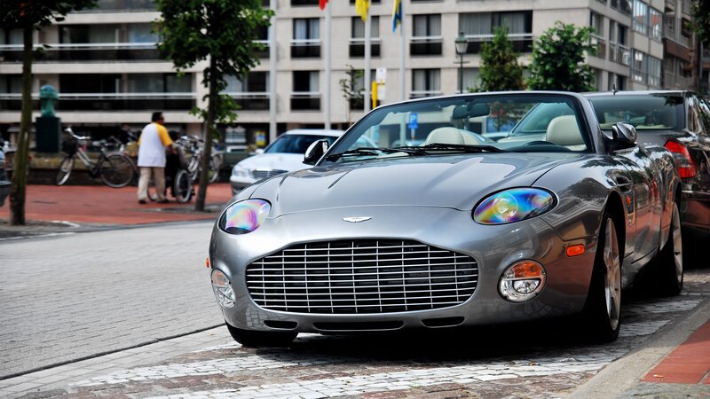 Silver Aston Martin parked on street