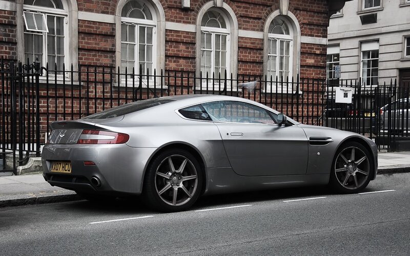 Silver Aston Martin parked on street