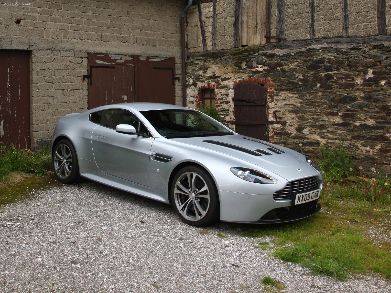 Silver Aston Martin V8 parked