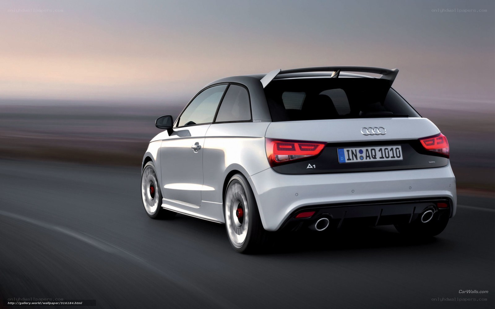 silver audi a1 driving on road