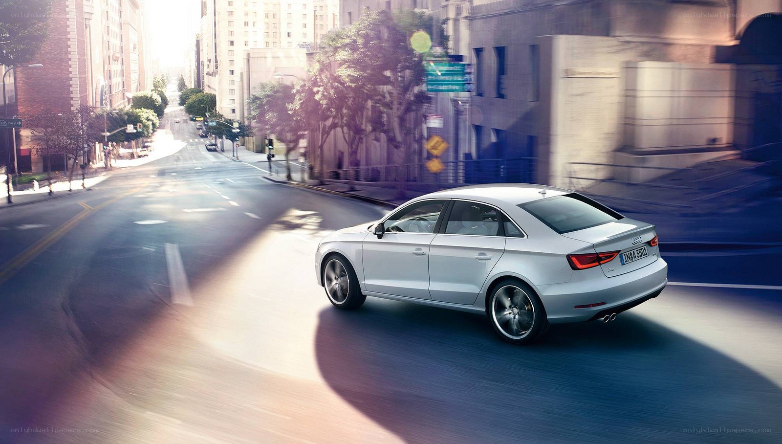 silver audi a3 driving in city