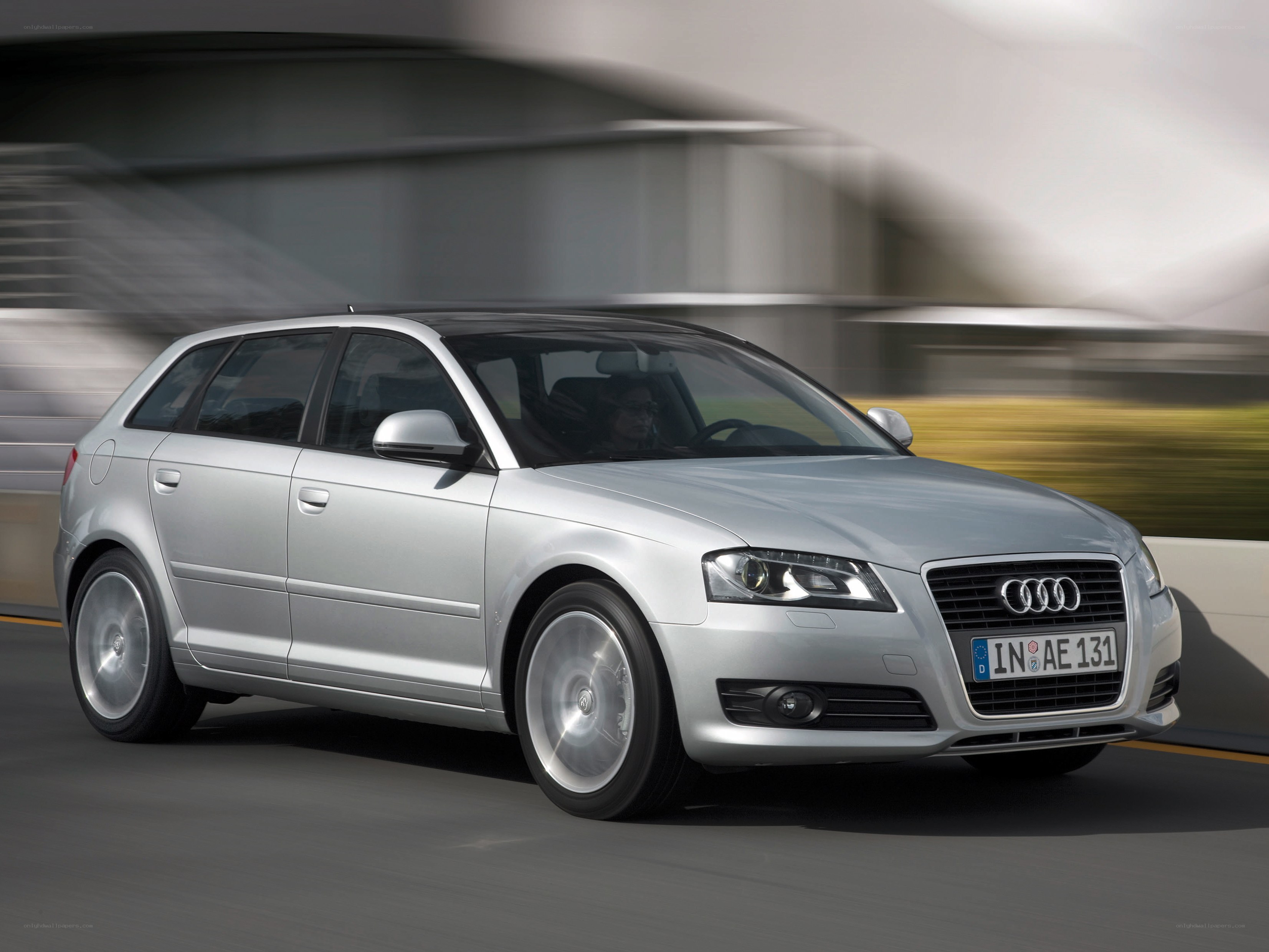 silver audi a3 in motion