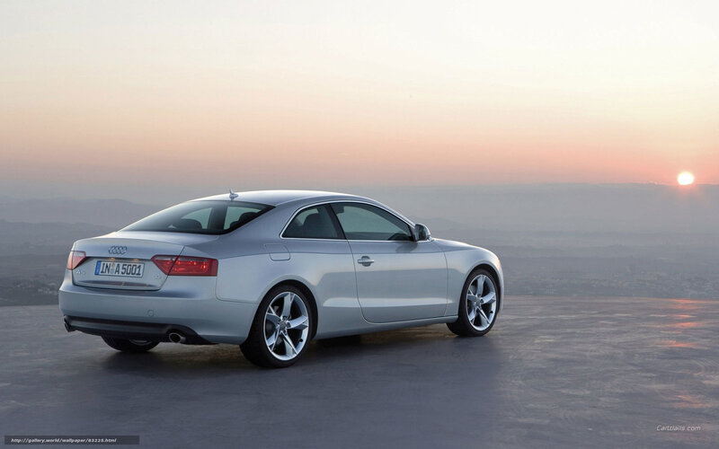 Silver Audi A5 at sunset