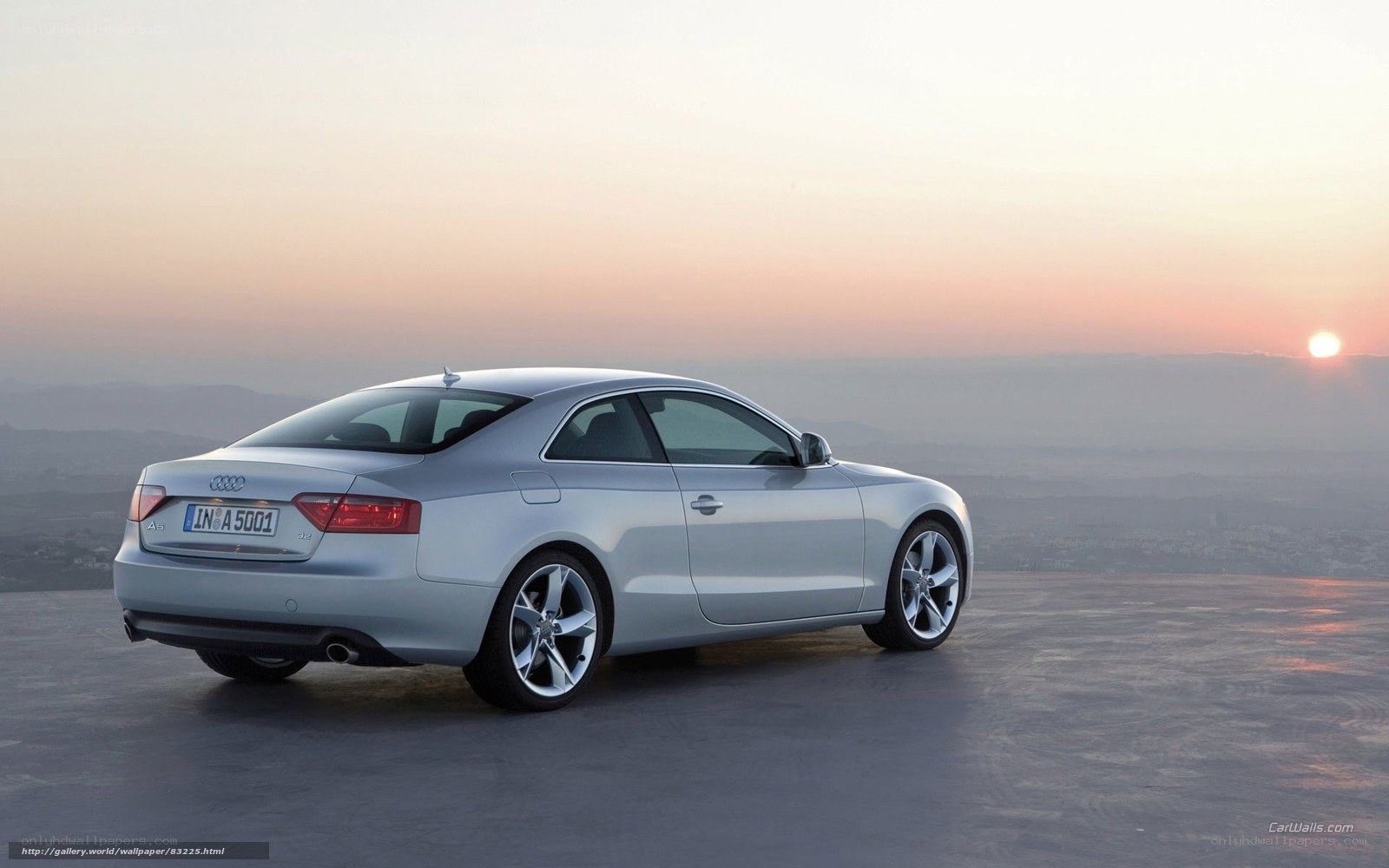 Silver Audi A5 at sunset