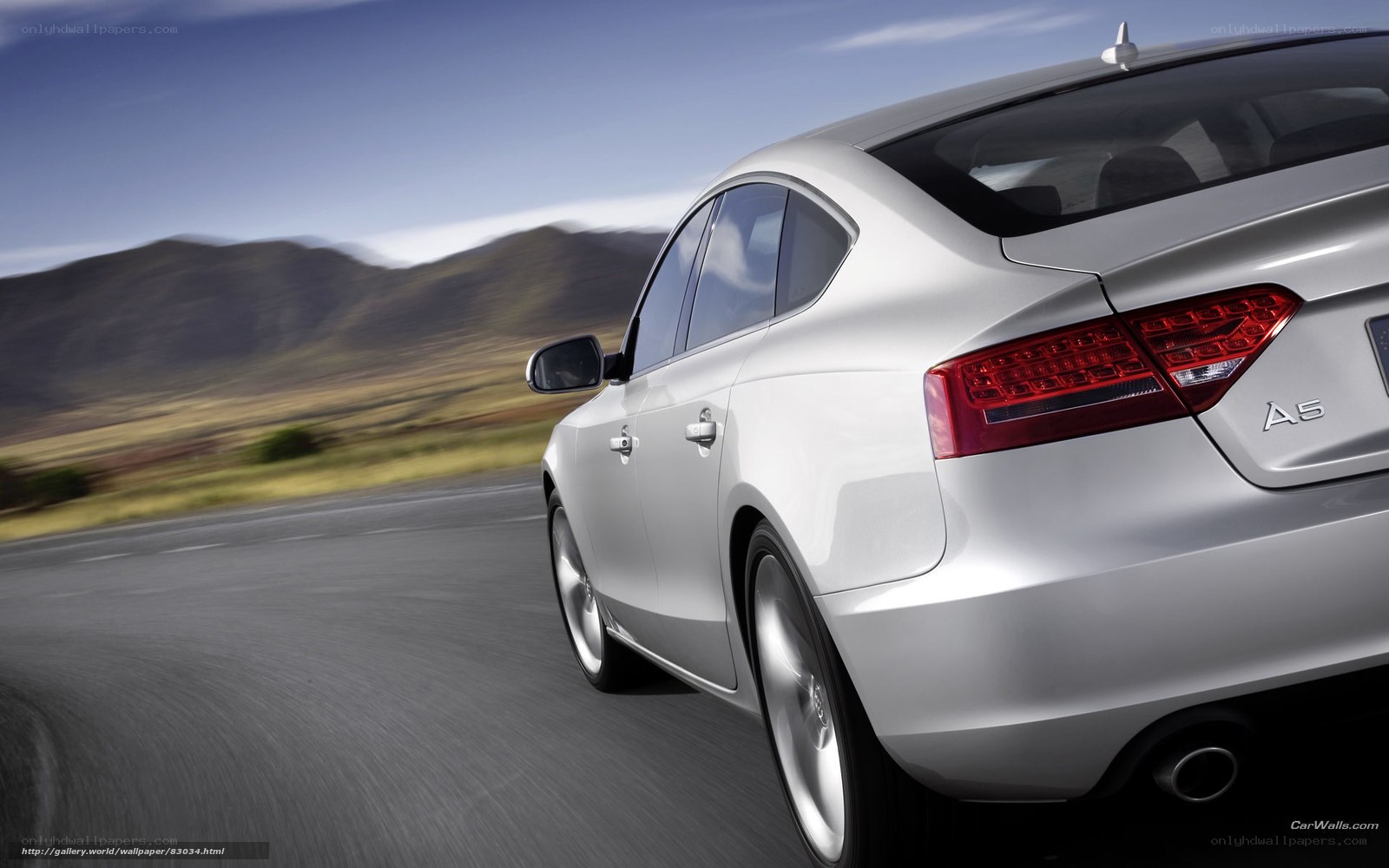 silver audi a5 driving on road