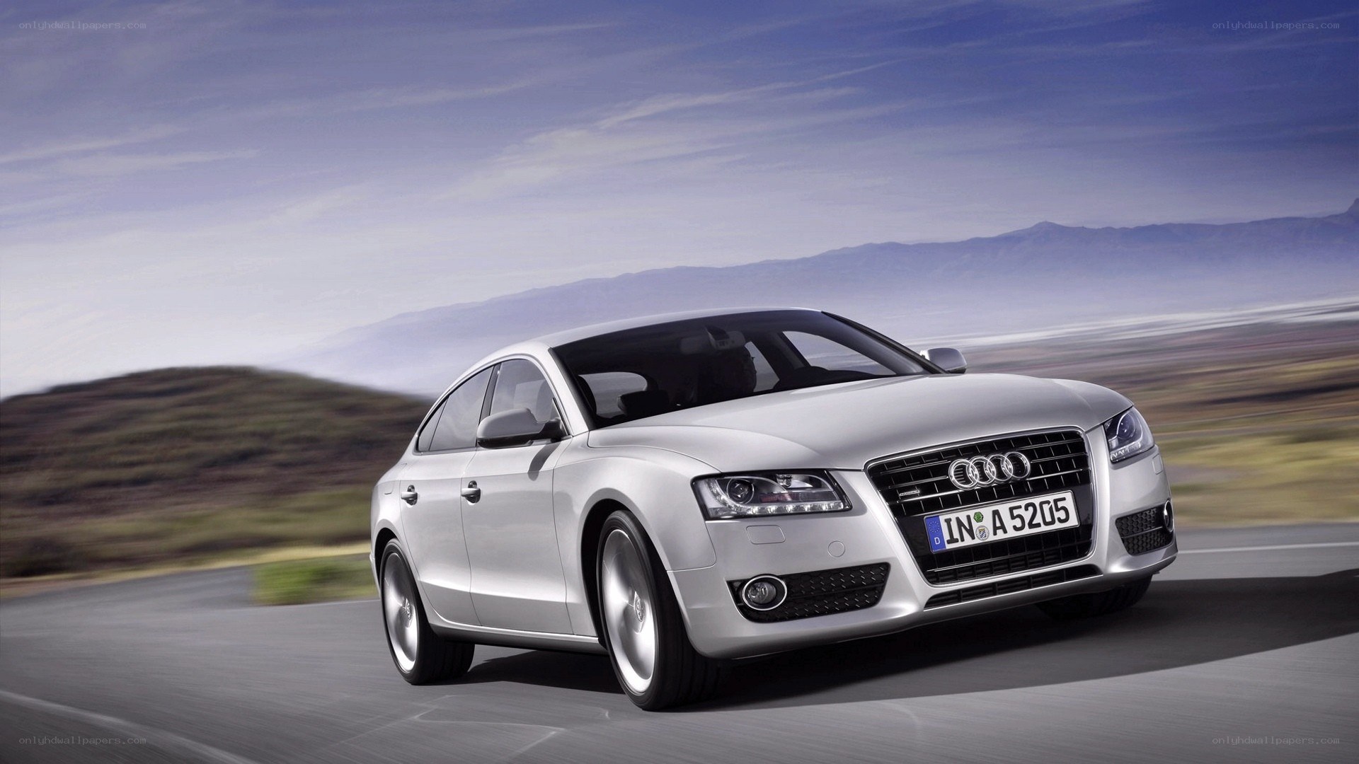 silver audi a5 in motion