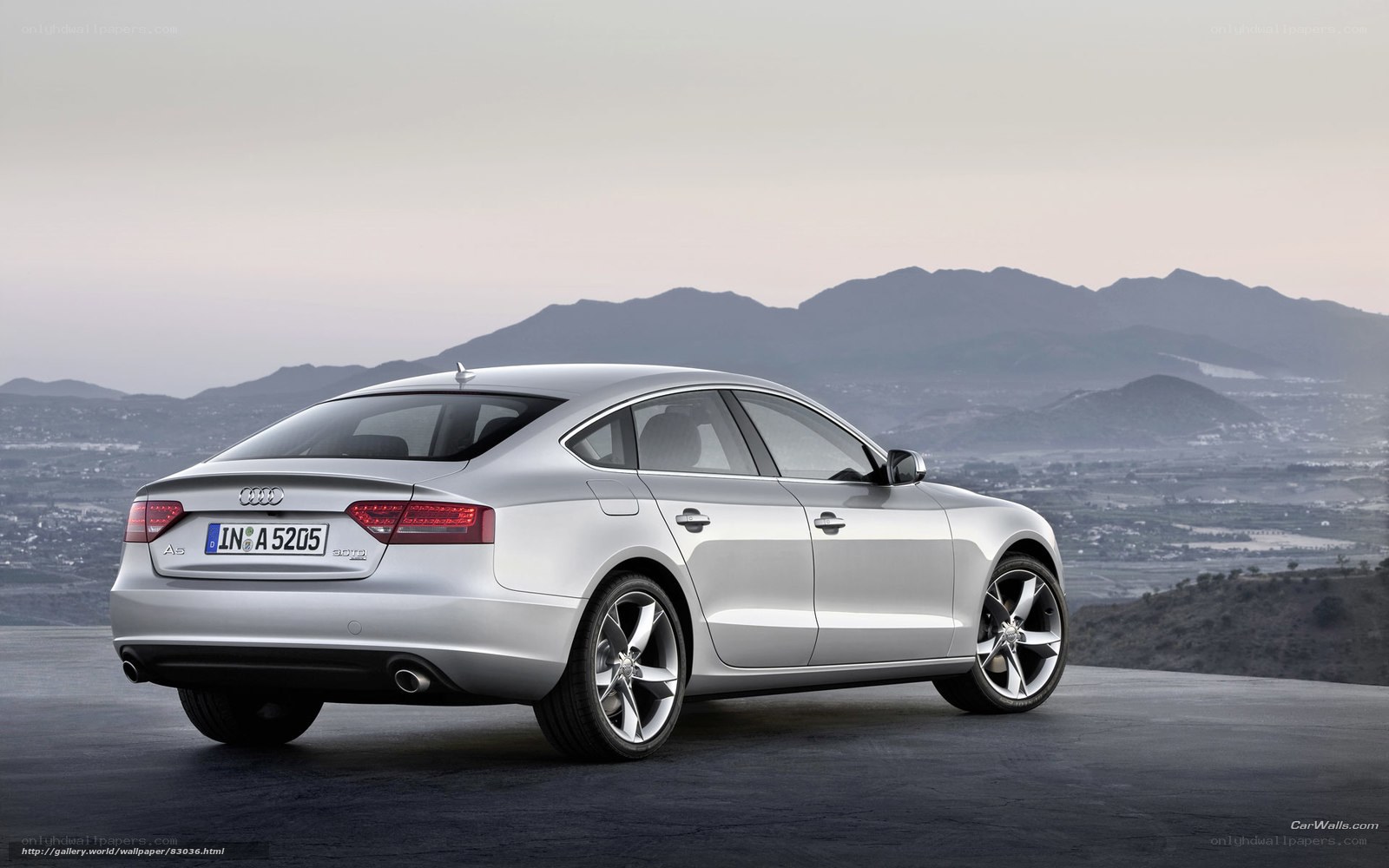 Silver Audi A5 on a mountain road