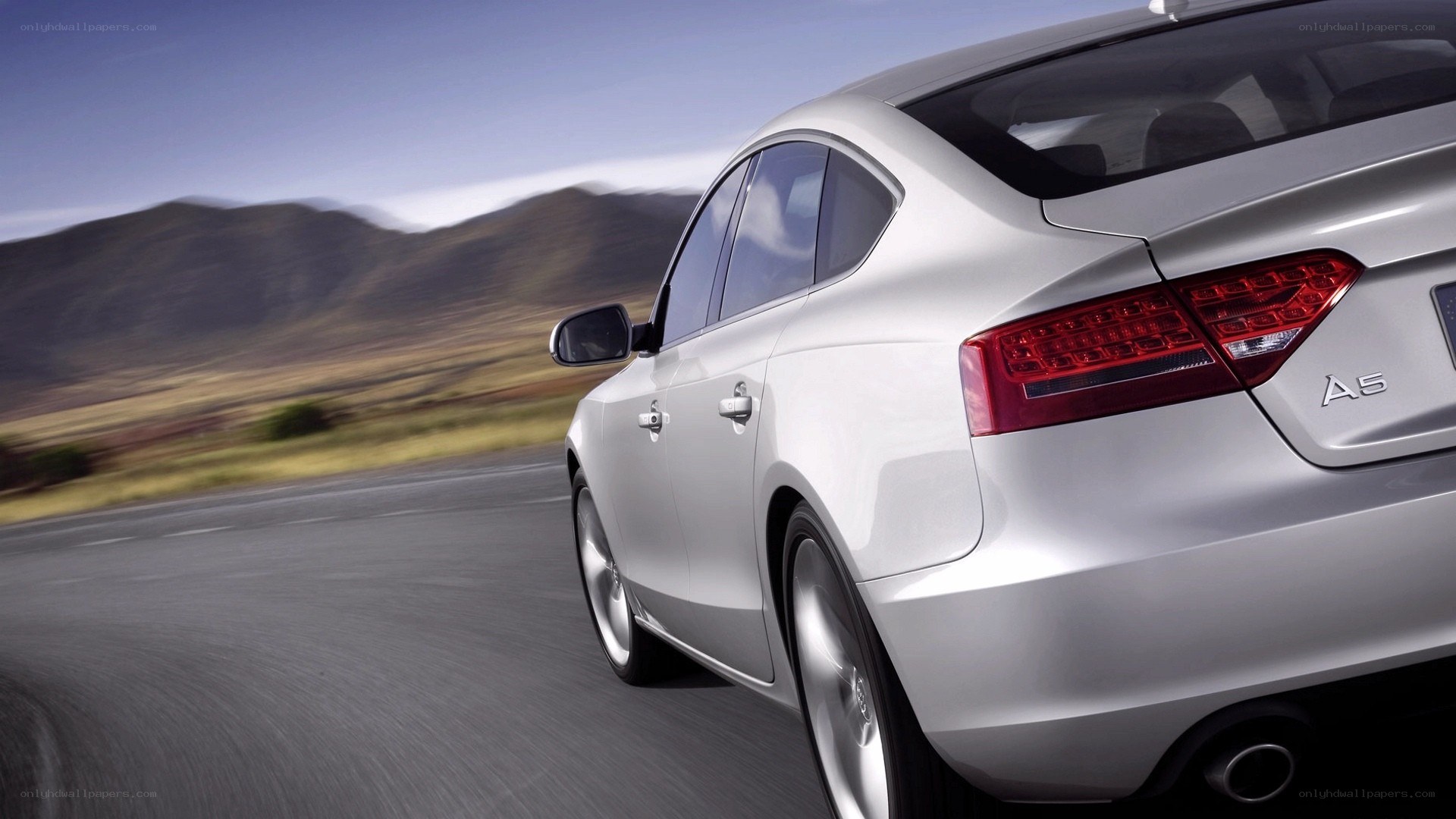 silver audi a5 on road