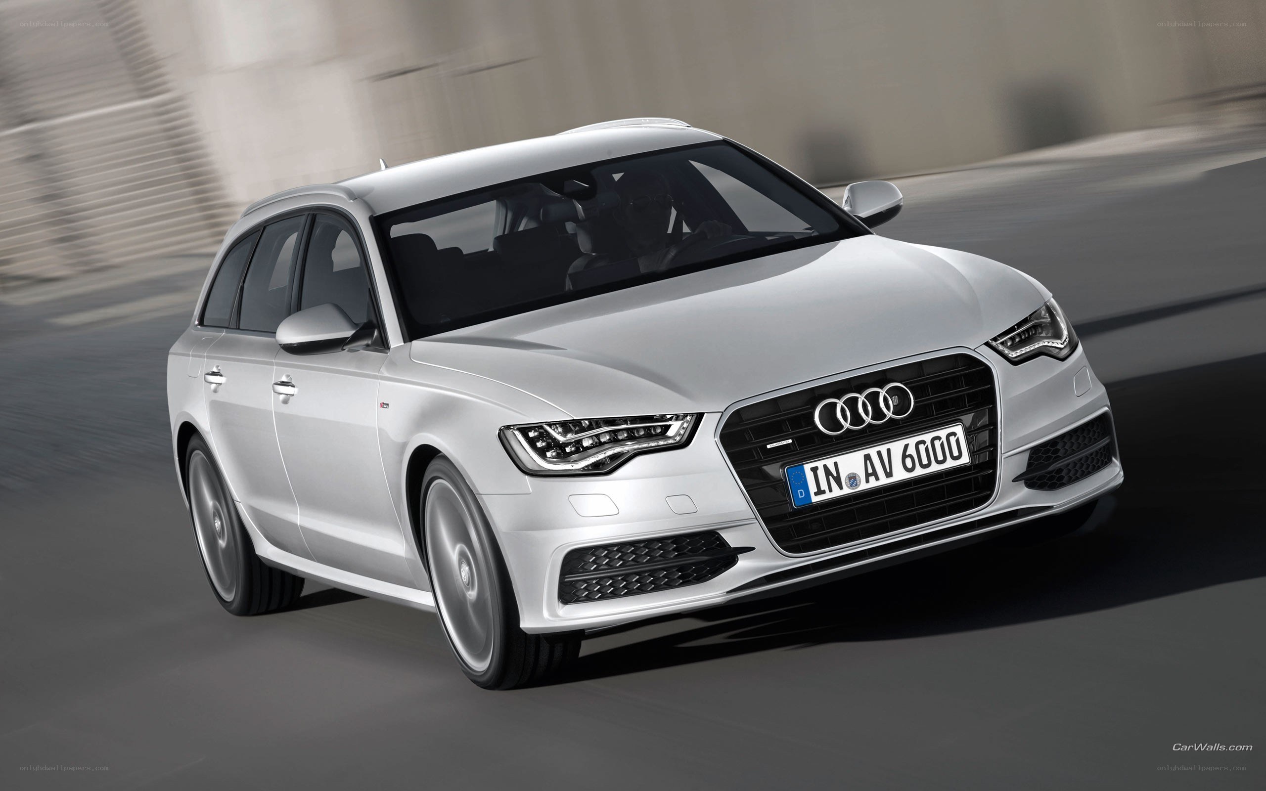 silver audi a6 avant in motion