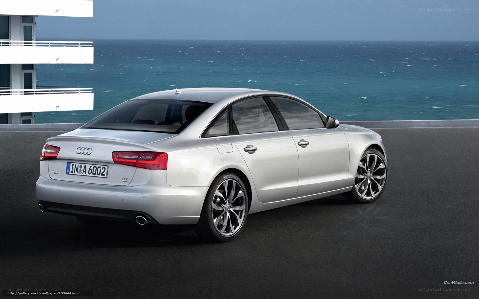 Silver Audi A6 by the sea