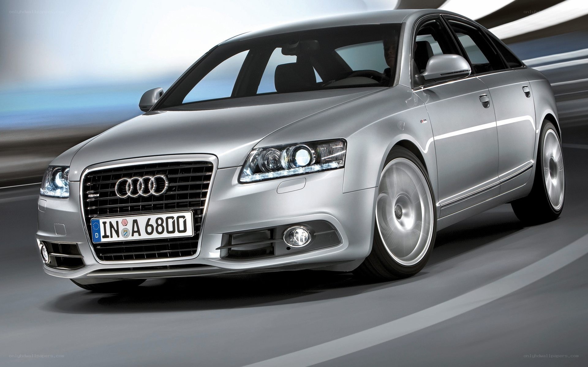 silver audi a6 in motion
