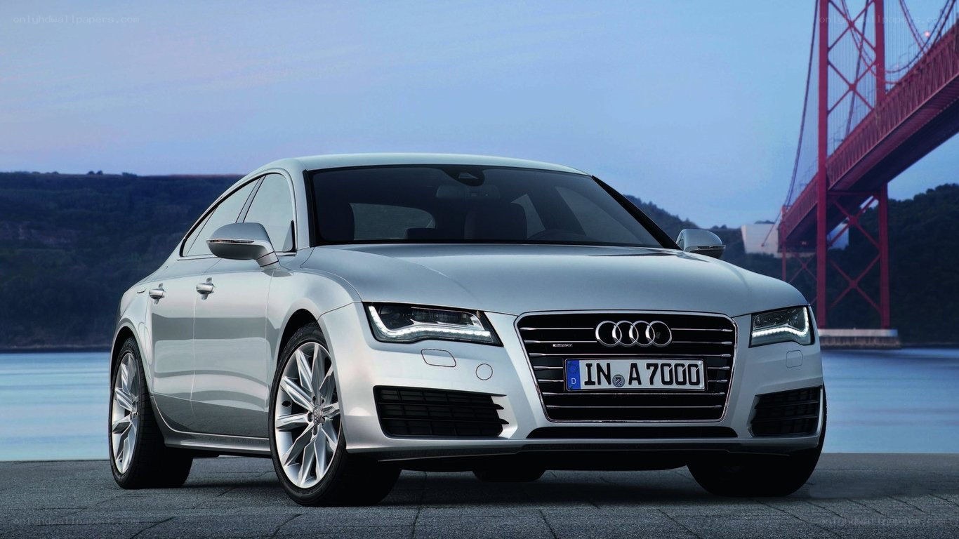 Silver Audi A7 by a bridge