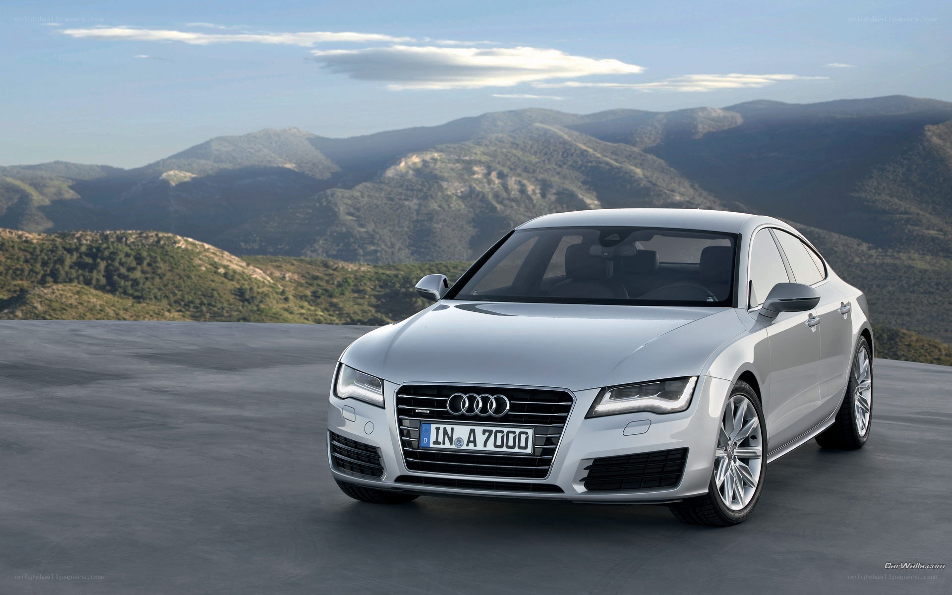 Silver Audi A7 on a mountain road