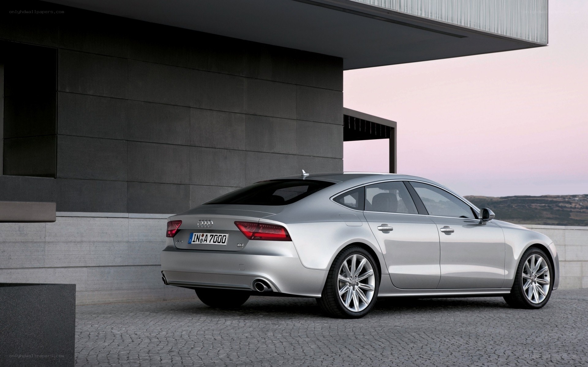 Silver Audi A7 parked outside