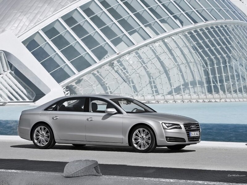 Silver Audi A8 by modern architecture