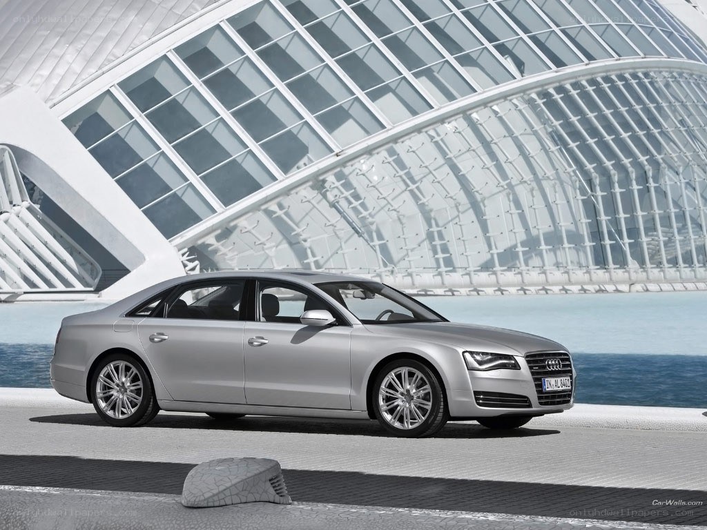 Silver Audi A8 by modern architecture