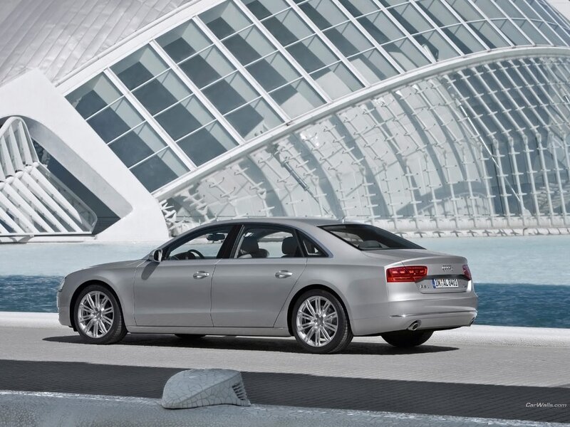 Silver Audi A8 by modern architecture