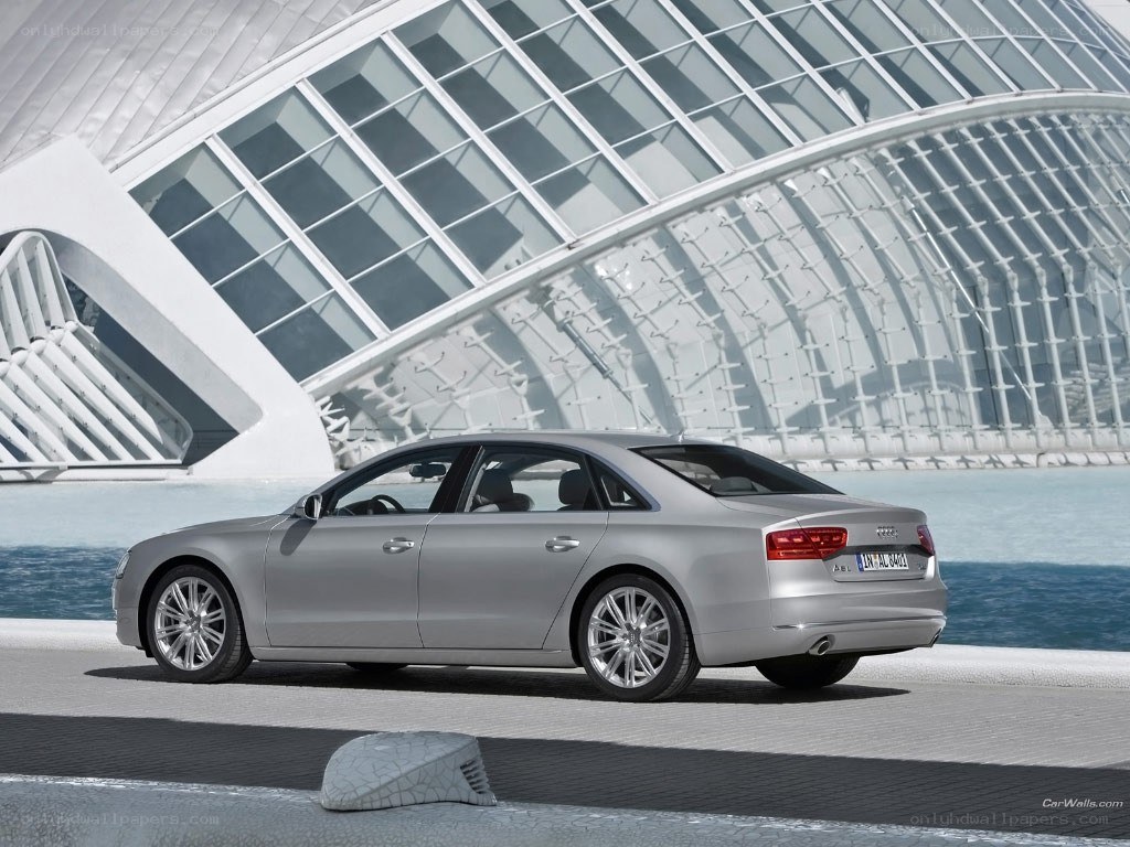 Silver Audi A8 by modern architecture