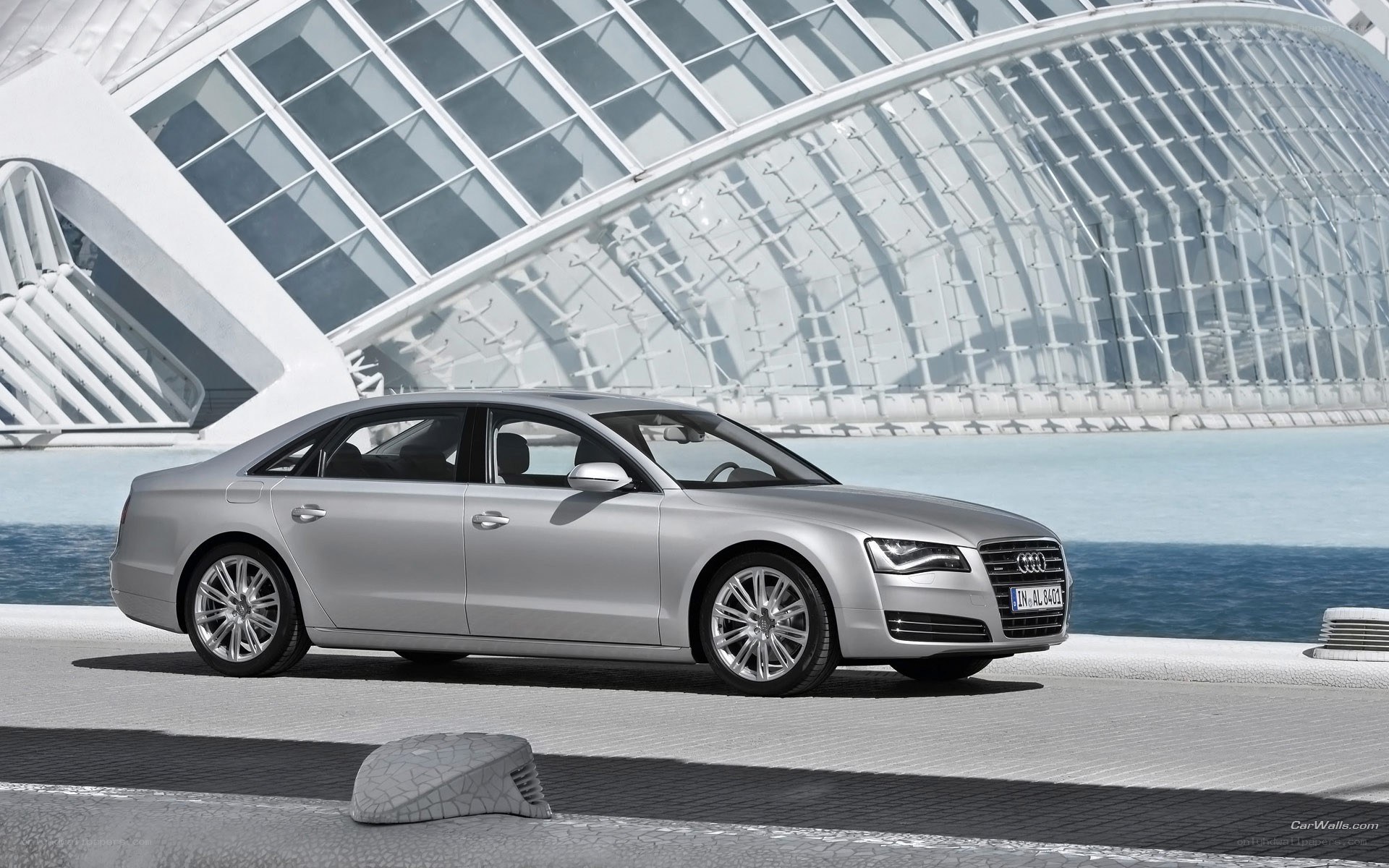 Silver Audi A8 by modern architecture