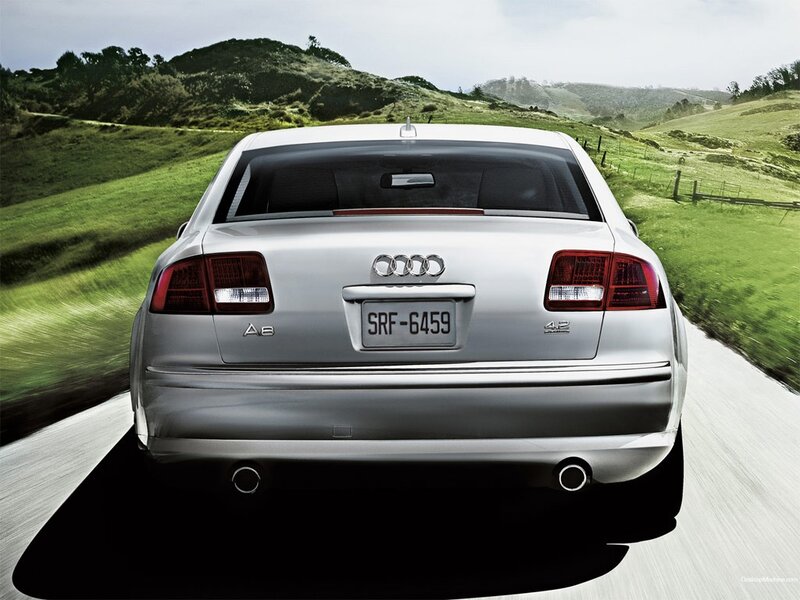 silver audi a8 driving on country road