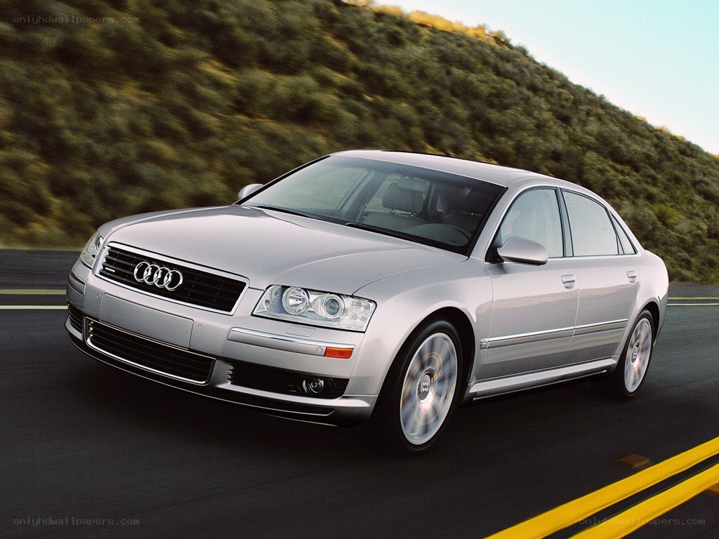 silver audi a8 driving on road