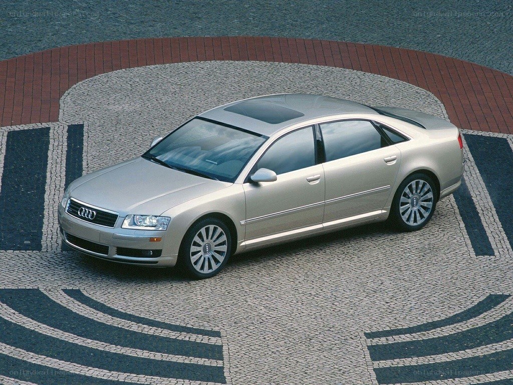 silver audi a8 on patterned pavement